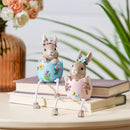 Hop Into Spring Table Decor Resin Bunny in Egg with Dandling Legs, 8"H, Asst of 2